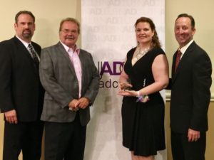 Kenneth Hitchner, public relations and social media director at Creative Marketing Alliance (CMA); Jeffrey Barnhart, CMA CEO and president; Victoria Hurley-Schubert, public relations and social media specialist and Christian Amato CMA COO, after she was recognized.